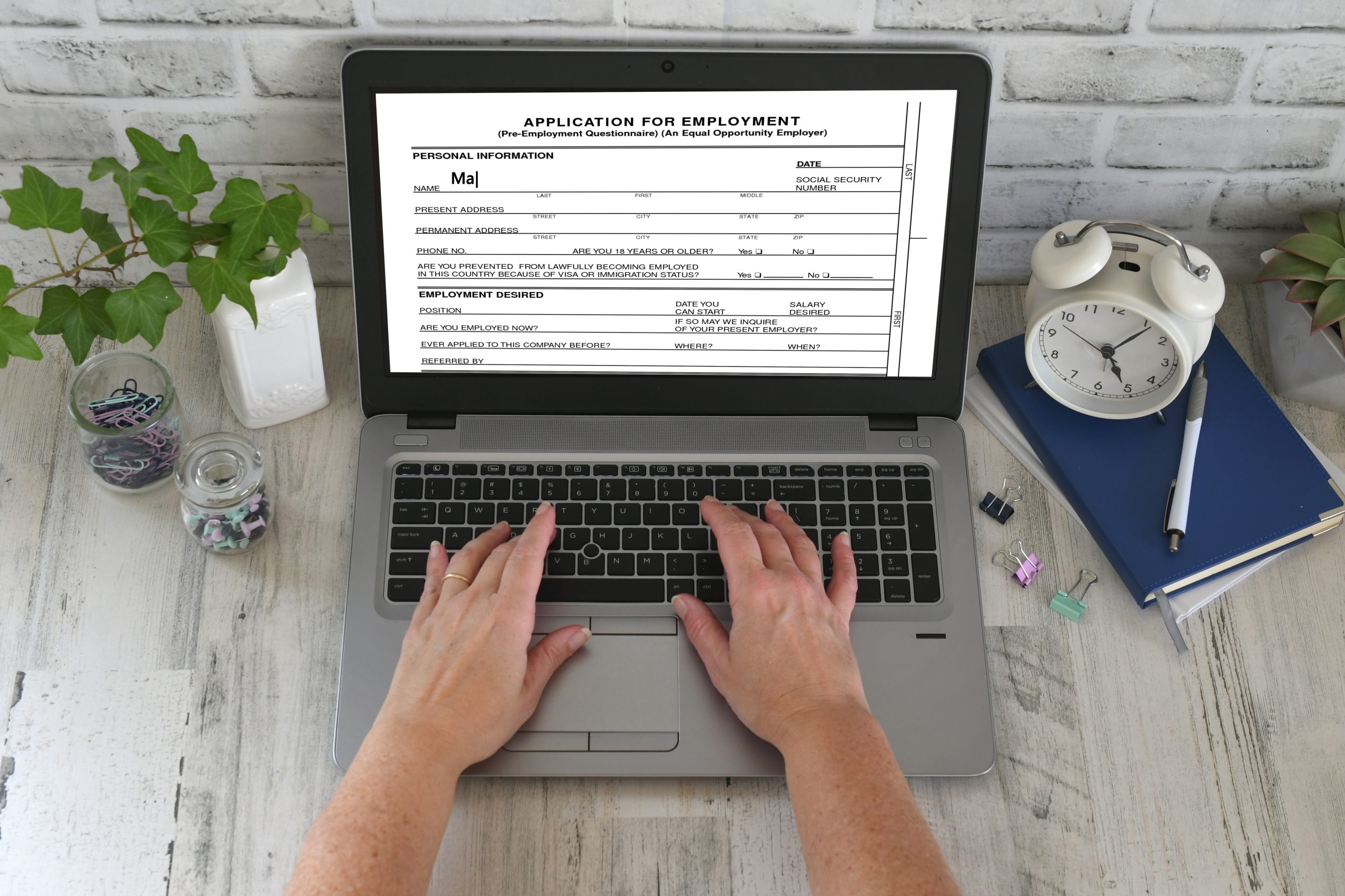 example of a paperless form. a man filling out an employment application online.